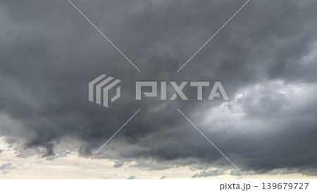 Dark storm clouds fill the entire frame. Massive gray formations create a heavy, atmospheric mood. Ominous weather patterns dominate the sky. Swirling overcast layers suggest approaching rain, Dark storm clouds fill the entire frame. Massive gray formations create a heavy, atmospheric mood. Ominous weather patterns dominate the sky. Swirling overcast layers suggest approaching rain, 139679727