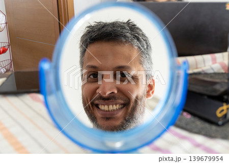 Cheerful Man in Round Mirror Cheerful Man in Round Mirror 139679954