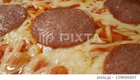Delicious pizza topped with pepperoni and cheese, fresh from the oven on a warm afternoon Delicious pizza topped with pepperoni and cheese, fresh from the oven on a warm afternoon 139680807