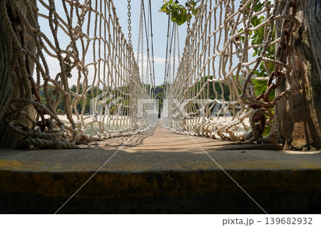 Suspension Bridge Leading to a Tropical Beach Paradise Suspension Bridge Leading to a Tropical Beach Paradise 139682932