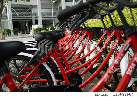 Red and White Bicycles Parked in a Row Red and White Bicycles Parked in a Row 139682964
