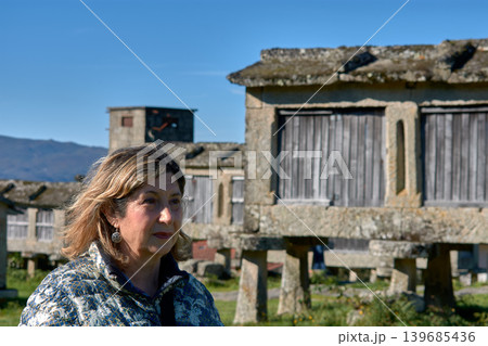 Portrait of a woman enjoying the charm of Lindoso iconic granaries in Portugal 139685436