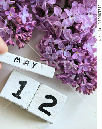 Purple Lilac Blossoms With May Twelve Date Display Purple Lilac Blossoms With May Twelve Date Display 139685715
