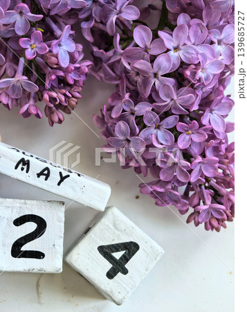 Purple Lilac Blossoms With May Twenty Fourth Calendar Date 139685727