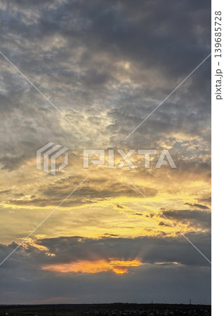 Vertical Sunset Sky With Glowing Storm Clouds Vertical Sunset Sky With Glowing Storm Clouds 139685728