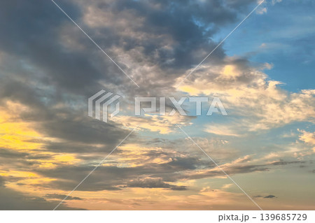 Blue And Golden Evening Sky With Layered Clouds Blue And Golden Evening Sky With Layered Clouds 139685729