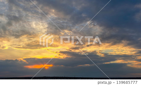 Dramatic Sunset Sky With Dark Storm Clouds 139685777