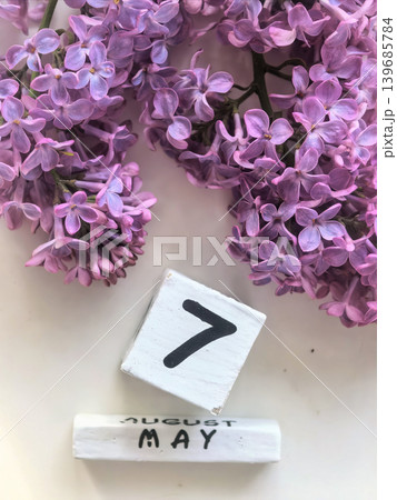 Purple Lilac Blossoms With May Seventh Calendar Date 139685784
