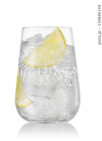 Glass of sparkling water with lemon and ice isolated on white background Glass of sparkling water with lemon and ice isolated on white background 139686149