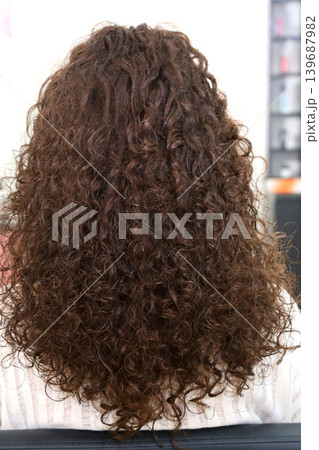 Beauty salon and makeup. Women's Hair Salon. The stylists at the women's salon are working with a young woman. Beauty salon and makeup. Women's Hair Salon. The stylists at the women's salon are working with a young woman. 139687982
