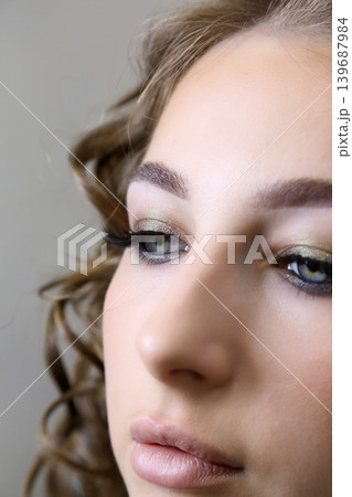 Beauty salon and makeup. Women's Hair Salon. The stylists at the women's salon are working with a young woman.  139687984