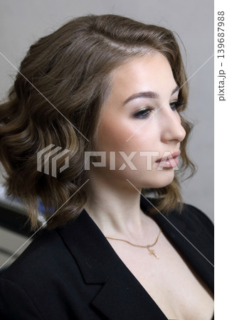 Beauty salon and makeup. Women's Hair Salon. The stylists at the women's salon are working with a young woman. Beauty salon and makeup. Women's Hair Salon. The stylists at the women's salon are working with a young woman. 139687988