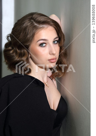Beauty salon and makeup. Women's Hair Salon. The stylists at the women's salon are working with a young woman. Beauty salon and makeup. Women's Hair Salon. The stylists at the women's salon are working with a young woman. 139688008
