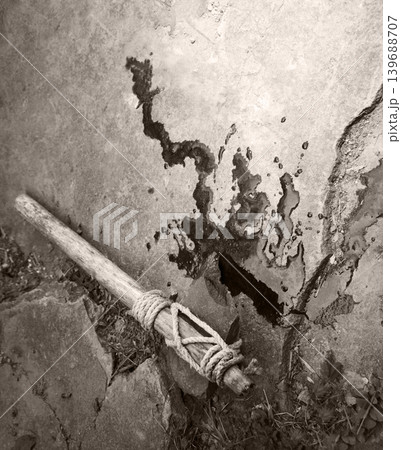 Stone axe with red blood 139688707