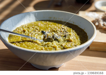 Traditional Jeju Sea Snail Porridge in a Ceramic Bowl Traditional Jeju Sea Snail Porridge in a Ceramic Bowl 139689168