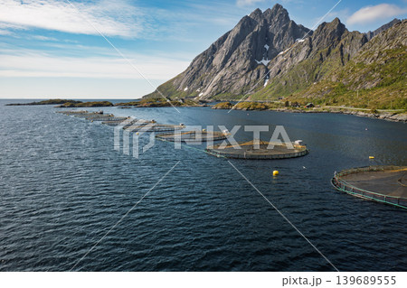 Farm salmon fishing in Norway. Norway is the biggest producer of farmed salmon in the world. Farm salmon fishing in Norway. Norway is the biggest producer of farmed salmon in the world. 139689555