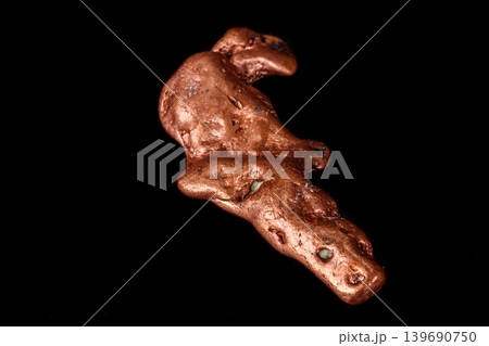 Macro mineral stone of a copper nugget on a microcline on a black background 139690750