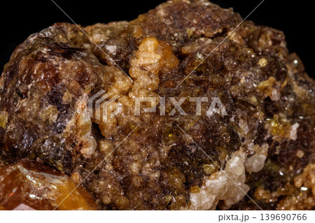 macro mineral stone Grossular, Garnet, Epidote on a black background 139690766