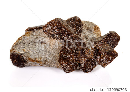 macro mineral stone Staurolite on a white background macro mineral stone Staurolite on a white background 139690768