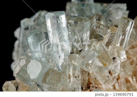 Macro mineral stone crystals Aquamarine in rock on a black background 139690791