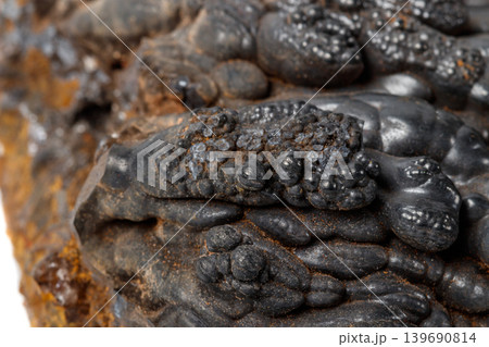 Macro mineral Hematite stone on a white background close-up Macro mineral Hematite stone on a white background close-up 139690814