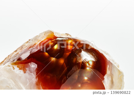 Macro mineral stone fiery Agate on a white background 139690822