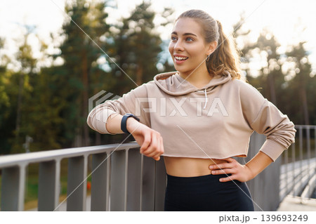 A young female athlete in special clothing is training on the court. Concept of sport, health. A young female athlete in special clothing is training on the court. Concept of sport, health. 139693249