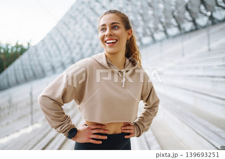 A young female athlete in special clothing is training on the court. Concept of sport, health. A young female athlete in special clothing is training on the court. Concept of sport, health. 139693251