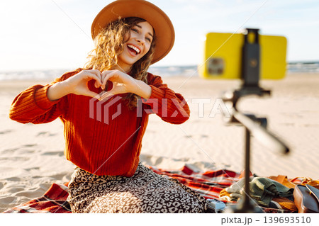 Style woman using smartphone with stabilizer. Travel, blogging, technology concept. Style woman using smartphone with stabilizer. Travel, blogging, technology concept. 139693510