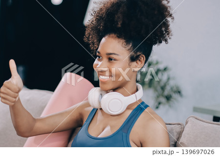 Women exercising in fitness studio yoga classes Women exercising in fitness studio yoga classes 139697026