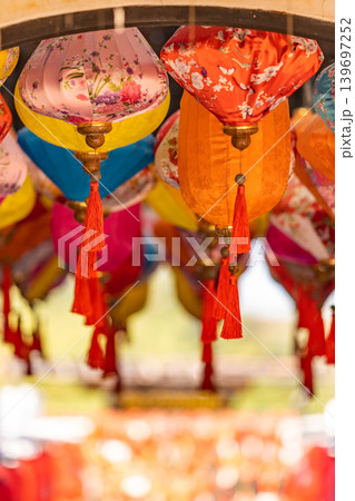 The colorful traditional Chinese lantern decorated at the wooden arch of the entrance to Lunar New Year festival. 139697252