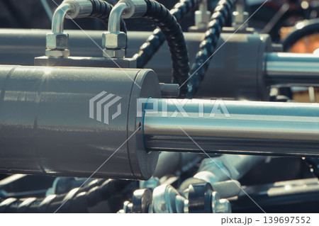 Gray piston or actuator in black pneumatic or hydraulic machine. Technology 139697552