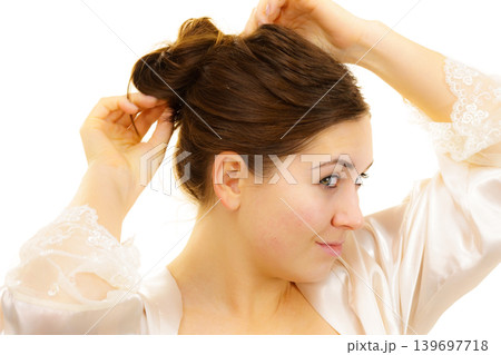 Girl with no makeup unties her hair Girl with no makeup unties her hair 139697718