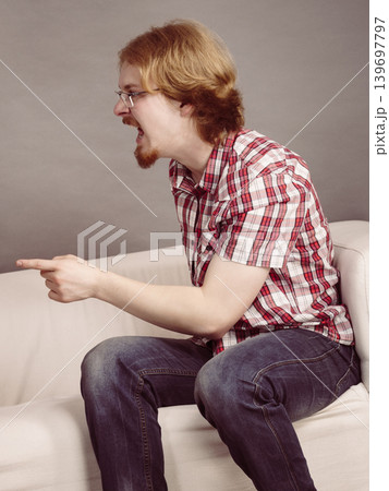 Angry man being angry talking with someone Angry man being angry talking with someone 139697797