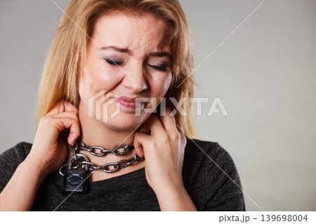 Woman having chain around neck 139698004