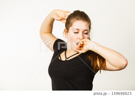 Young tired woman yawning 139698023