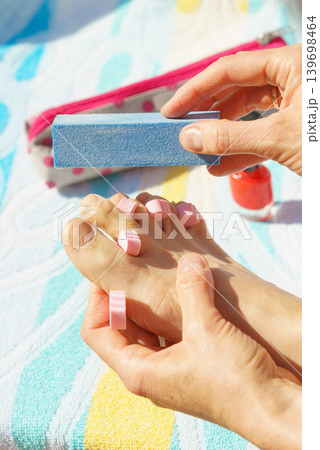 Woman pedicure outdoor Woman pedicure outdoor 139698464