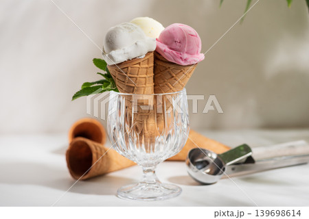 Ice Cream Cones with Strawberries and Mint on White Background 139698614