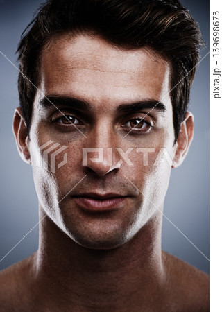 Portrait, skincare and man with cosmetics, dermatology and grooming on grey studio background. Person, guy or model with routine or treatment with wellness or shine with beauty, glowing or confident 139698673