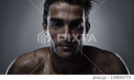 Portrait, man and water with skincare, sweating and dermatology on a grey studio background. Face, person and purple liquid with hydration and beauty with morning routine, wet and luminescent with uv Portrait, man and water with skincare, sweating and dermatology on a grey studio background. Face, person and purple liquid with hydration and beauty with morning routine, wet and luminescent with uv 139698779