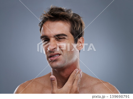Man, shave and rash pain from razor burn for hair removal for hygiene maintenance, mistake or grey background. Male person, hand and unhappy in studio or care fail in inflammation, itchy or mockup Man, shave and rash pain from razor burn for hair removal for hygiene maintenance, mistake or grey background. Male person, hand and unhappy in studio or care fail in inflammation, itchy or mockup 139698791