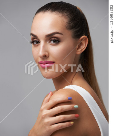 Cosmetics portrait, nail polish color and woman with studio makeup, beauty care or creativity in rainbow hand paint design. Manicure art, fresh treatment and salon girl isolated on grey background 139698802