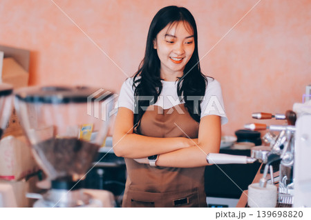 Young woman at barista school learning how to make espresso coffee. Young woman at barista school learning how to make espresso coffee. 139698820