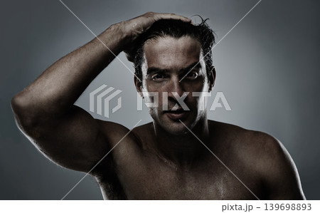 Portrait, man and water with dermatology, sweating and morning routine on a grey studio background. Face, person and grooming with hydration and beauty with model, wet and cosmetics with skincare Portrait, man and water with dermatology, sweating and morning routine on a grey studio background. Face, person and grooming with hydration and beauty with model, wet and cosmetics with skincare 139698893