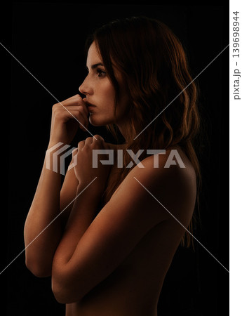 Thinking, body care and young woman in studio posing for beauty, art and creative aesthetic. Skin, beautiful and female model or person with idea face expression isolated by dark black background. Thinking, body care and young woman in studio posing for beauty, art and creative aesthetic. Skin, beautiful and female model or person with idea face expression isolated by dark black background. 139698944