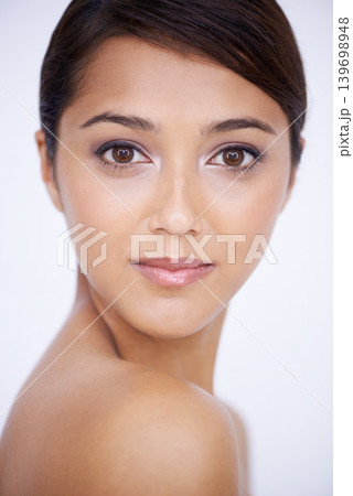 Portrait, cosmetics and woman with skincare, beauty and grooming on white studio background. Face, Indian person and makeup with shine and dermatology with healthy skin, smooth or aesthetic with glow Portrait, cosmetics and woman with skincare, beauty and grooming on white studio background. Face, Indian person and makeup with shine and dermatology with healthy skin, smooth or aesthetic with glow 139698948