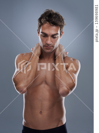 Thinking, skincare and man with cosmetics, shirtless and dermatology on a grey studio background. Person, thoughts and model with wellness and muscular with health and grooming with shine or body 139698981