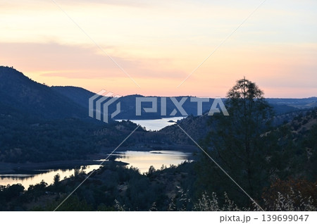 Scenic mountain valley with winding lakes at sunset overview panorama. Scenic mountain valley with winding lakes at sunset overview panorama. 139699047