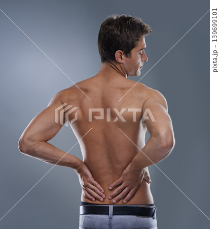 Back pain, injury crisis and studio man with medical emergency, sore spine or osteoporosis. Backache, anatomy and person massage joint ache, accident or hurt muscle strain on grey background Back pain, injury crisis and studio man with medical emergency, sore spine or osteoporosis. Backache, anatomy and person massage joint ache, accident or hurt muscle strain on grey background 139699101
