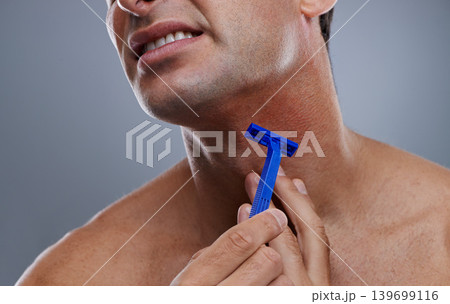 Person, shaving and beard or razor burn for hair removal or red rash, inflammation or grey background. Hand, tool and hygiene mistake in studio or accident for wellness maintenance, pain or mockup Person, shaving and beard or razor burn for hair removal or red rash, inflammation or grey background. Hand, tool and hygiene mistake in studio or accident for wellness maintenance, pain or mockup 139699116